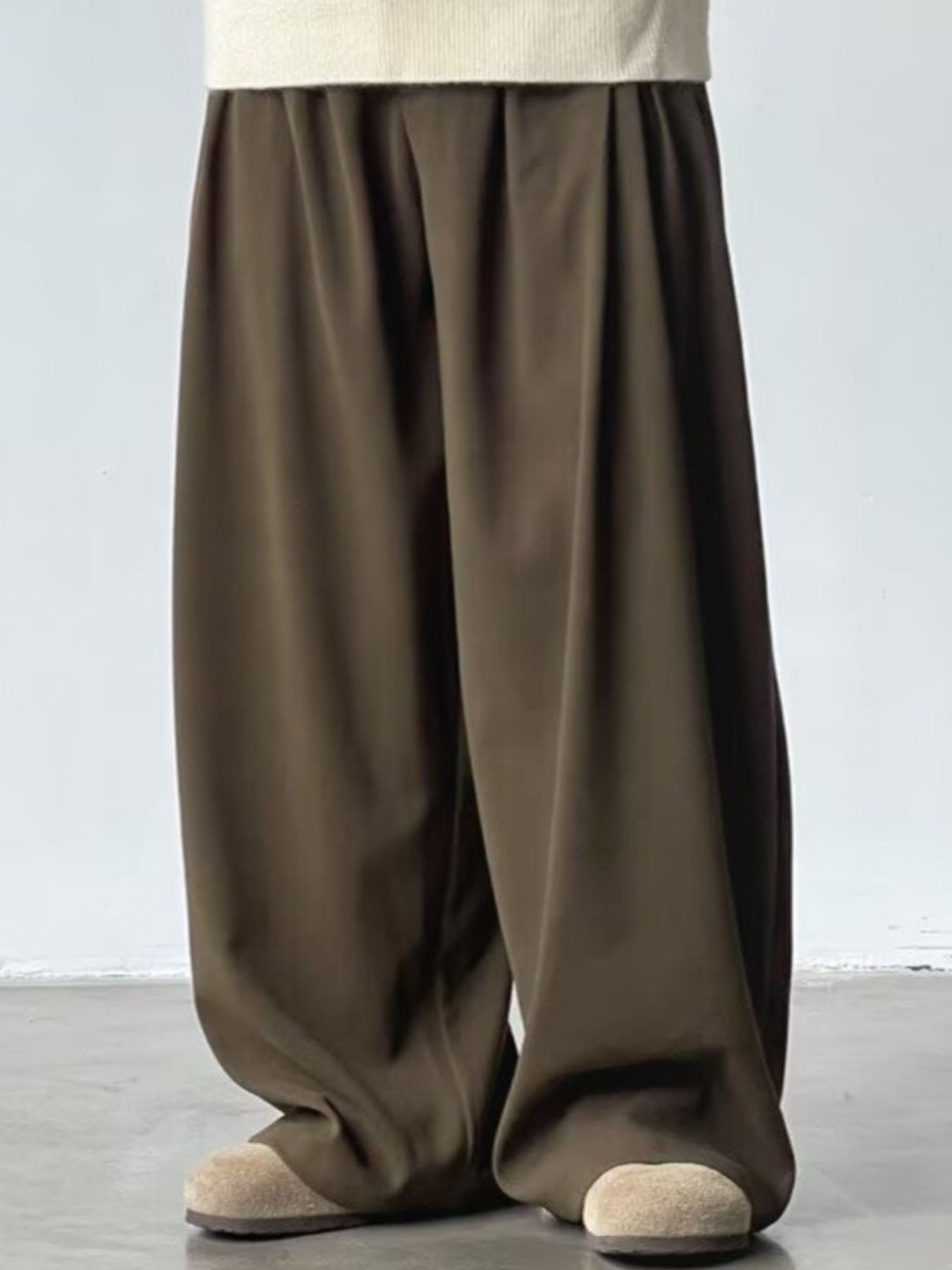 Men's dark brown wide leg sweatpants with elastic waistband and casual fit.