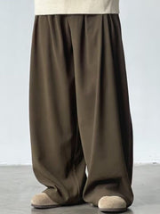 Men's dark brown wide leg sweatpants with elastic waistband and casual fit.