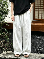 White wide-leg sweatpants with drawstring and front seams, men's casual pants.