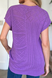 Purple knit patchwork top with cable and lace details, short sleeves.