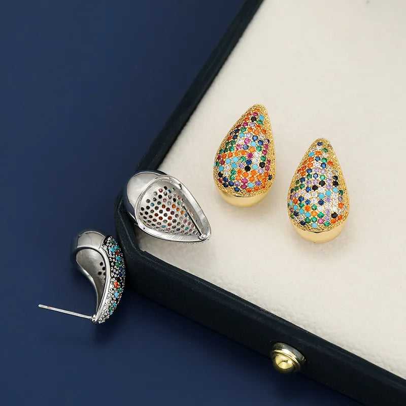 Pave teardrop stud earrings with gold base and colorful gemstones.