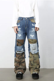 Camouflage patchwork distressed jeans in medium wash with baggy fit and ripped details.