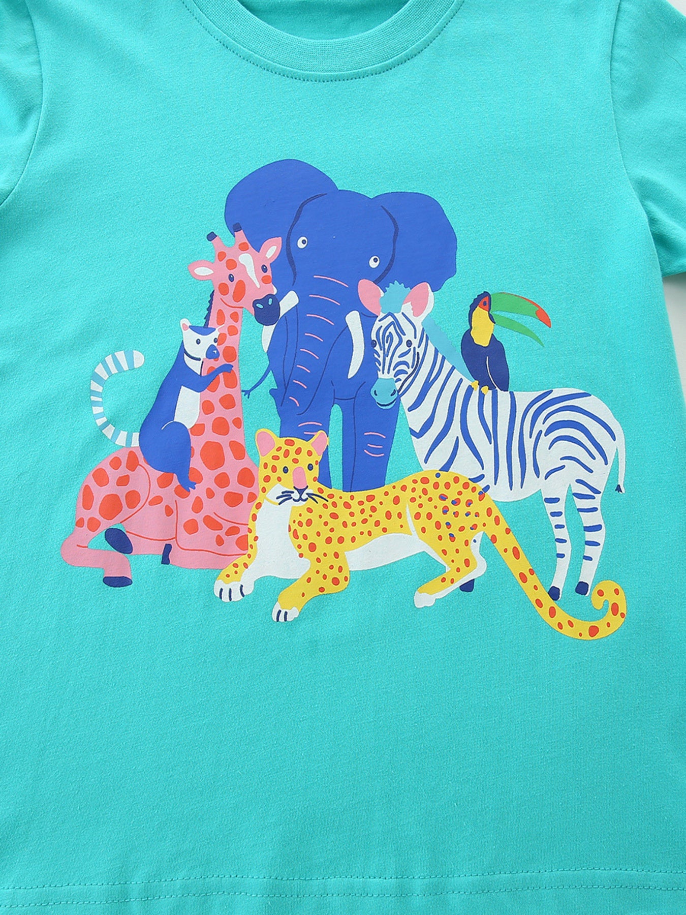 Crew neck t-shirt in teal with a playful safari animal graphic.