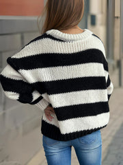 Chunky knit jumper with bold black and white stripes, crew neck, and relaxed fit.