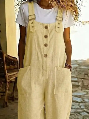 Yellow wide leg romper with button front, buckle straps, and large front pockets.