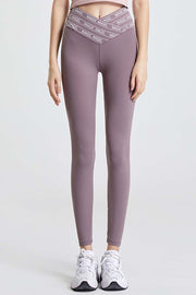Mauve Angel Band active leggings with a V-shaped waistband and white logo detail.