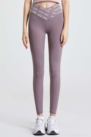 Mauve Angel Band active leggings with a V-shaped waistband and white logo detail.
