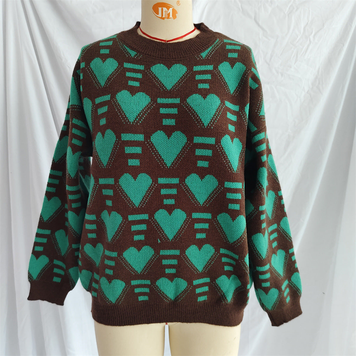 Brown acrylic knit jumper with allover geometric heart pattern in neon green.