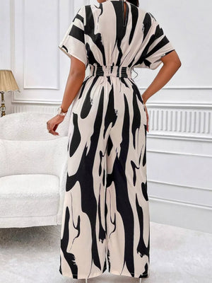 Black and white abstract print wide-leg romper with short sleeves and elastic waist