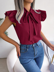 Burgundy ruffled sleeve pussybow blouse with a tie neck.