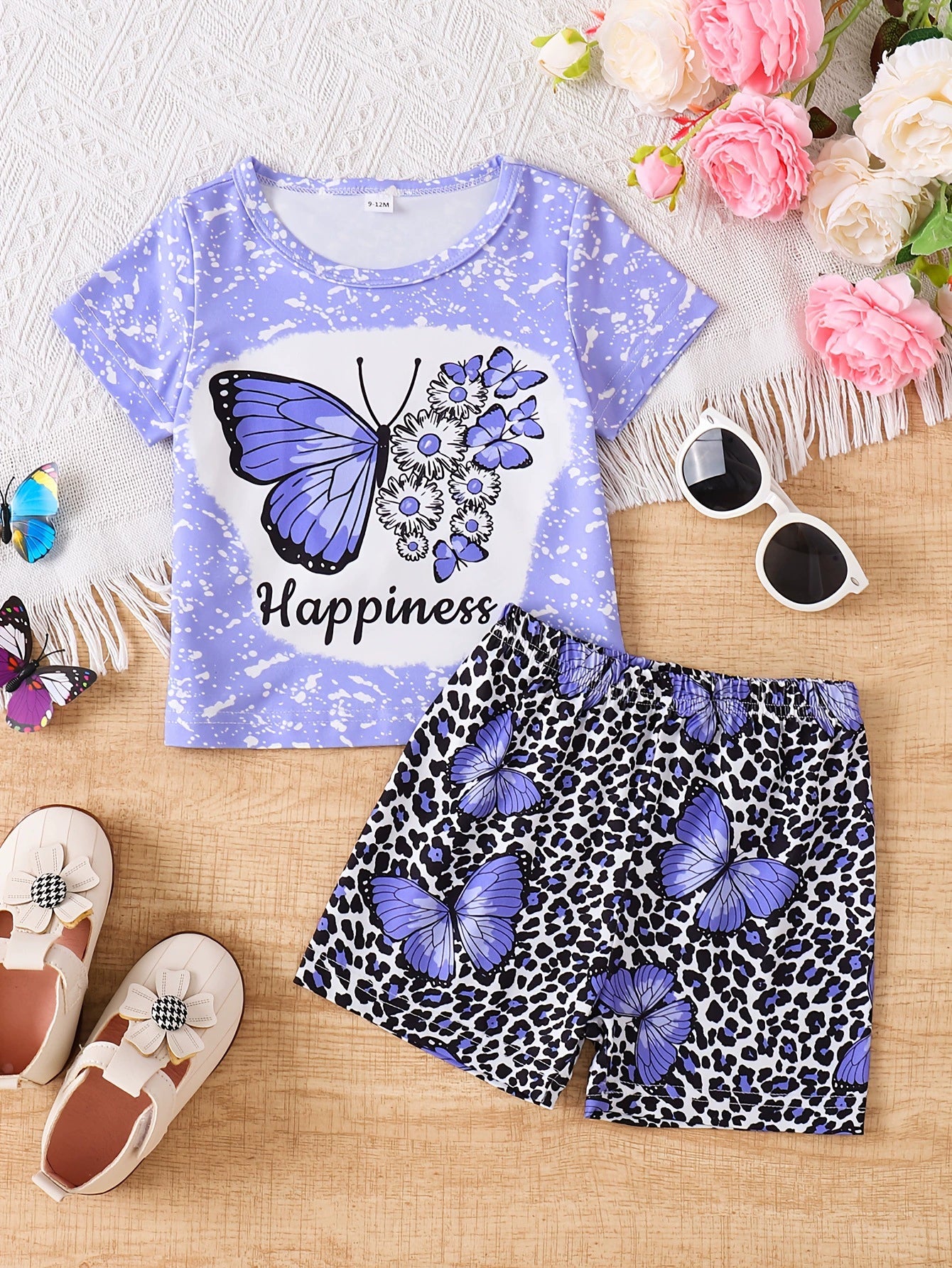 Children's purple butterfly graphic tee and leopard print shorts set.