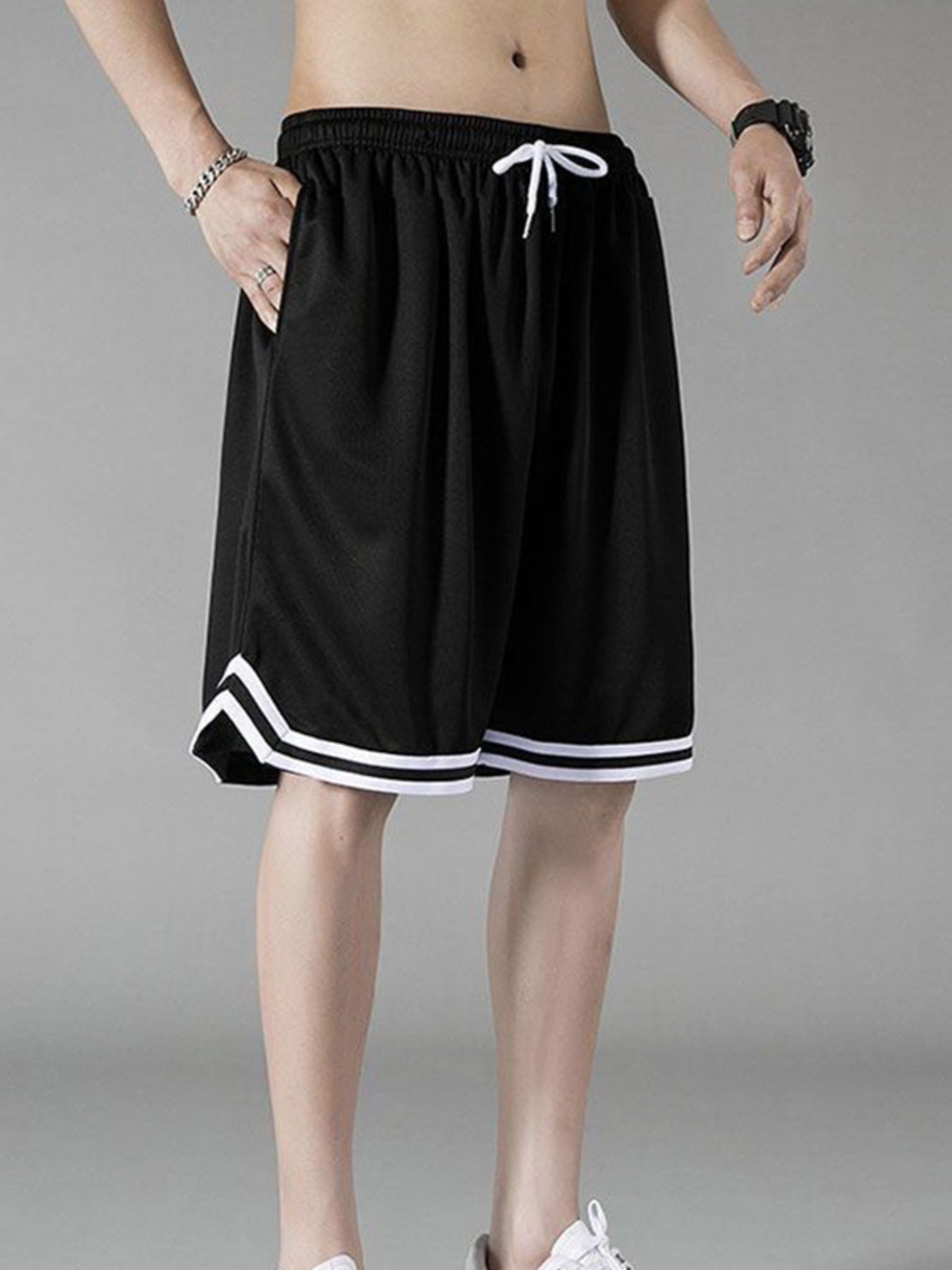 Men's black athletic shorts with white trim and drawstring