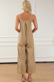 Tan corduroy overalls with wide leg silhouette and pleated detail on back.