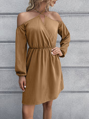 Khaki cross-strap off-shoulder mini dress with long sleeves and elastic waist.