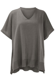 Relaxed V-neck knit poncho top in dark gray with short sleeves and ribbed hem.