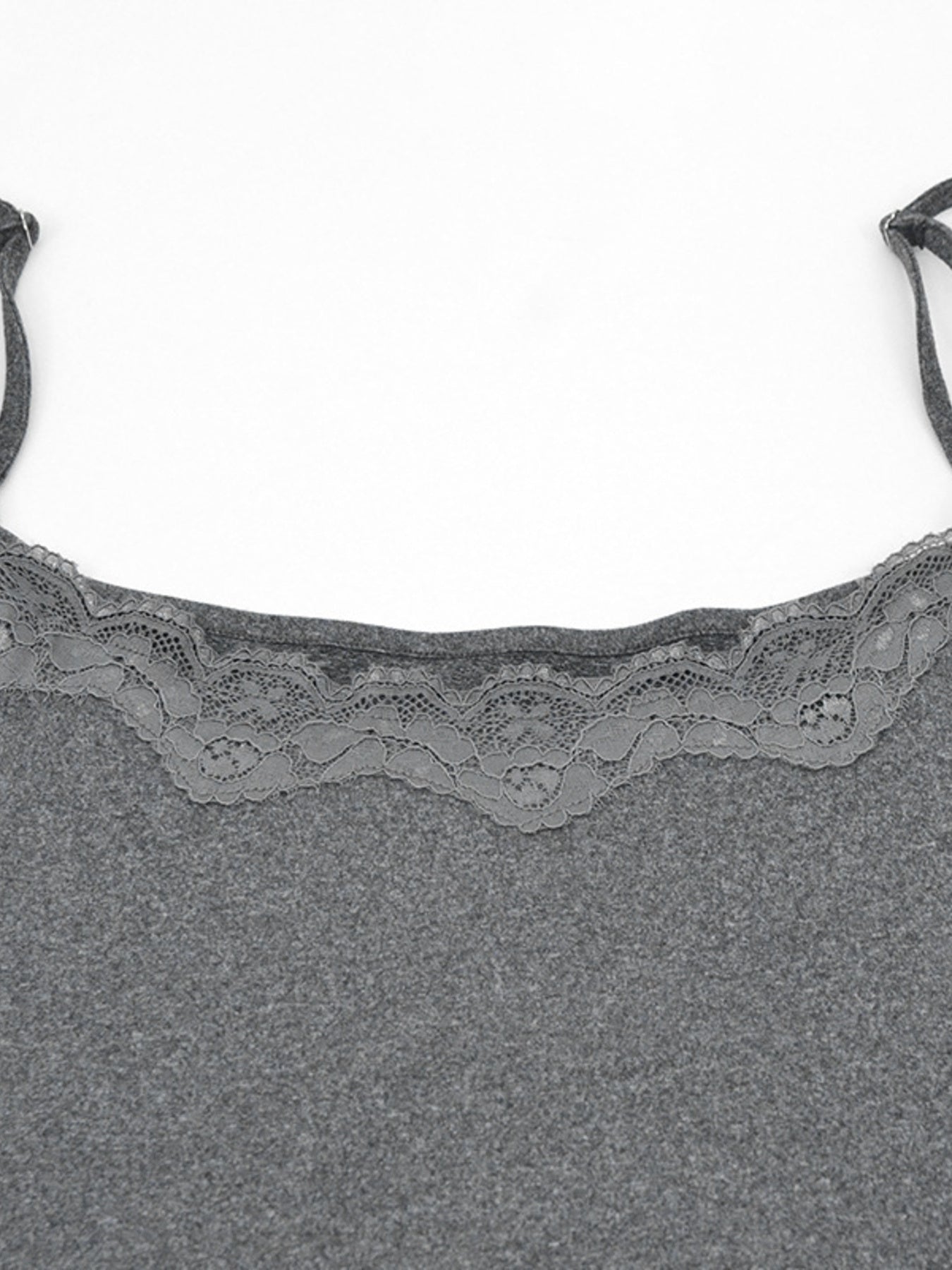 Grey bodycon mini dress with lace trim neckline and spaghetti straps.