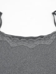 Grey bodycon mini dress with lace trim neckline and spaghetti straps.