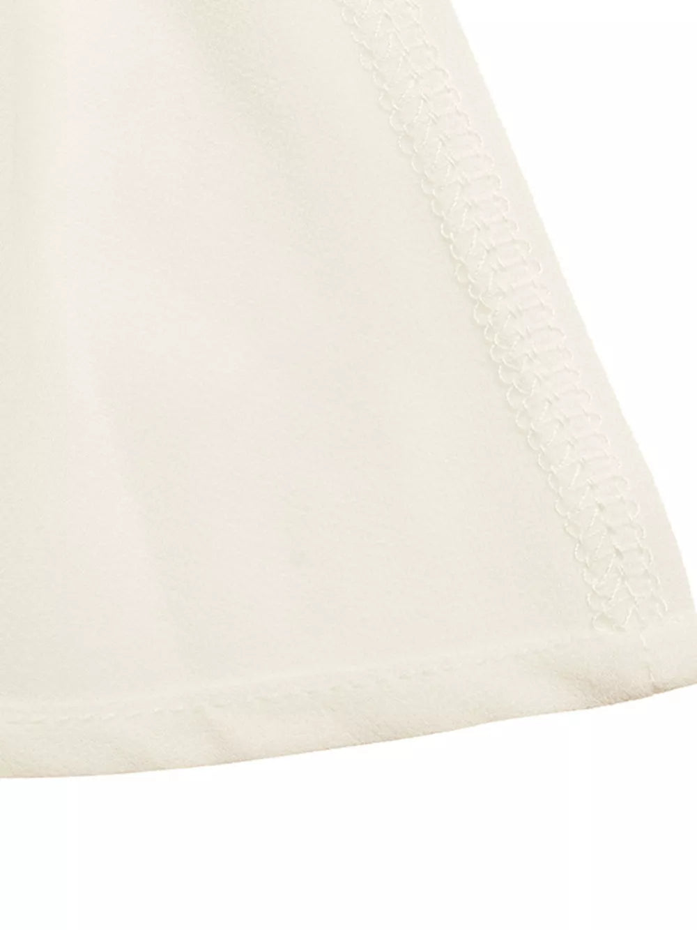 Cream cami top with gathered neckline detail and peplum hem