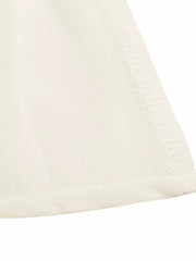 Cream cami top with gathered neckline detail and peplum hem
