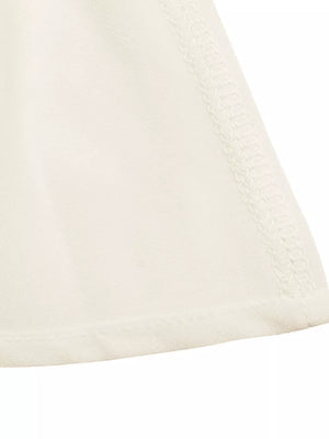 Cream cami top with gathered neckline detail and peplum hem