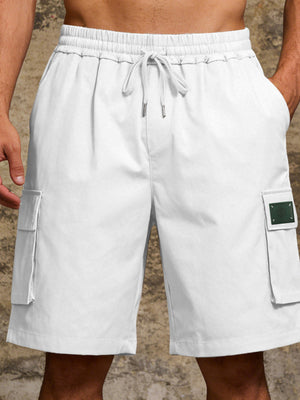 White cargo shorts with drawstring waist and side pocket detail.