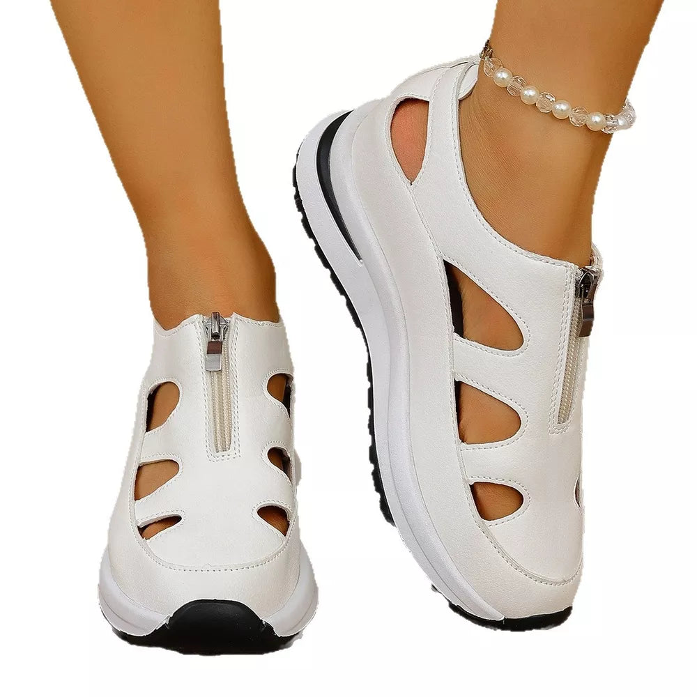 Chic white cutout wedge sneakers with zipper and chunky sole.
