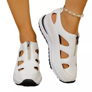 Chic white cutout wedge sneakers with zipper and chunky sole.