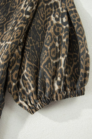 Denim dress with leopard print, puff sleeves, and elastic cuffs.