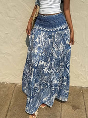 Bohemian paisley maxi skirt in blue with a smocked waistband and tiered flowy hem.