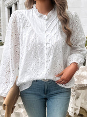 White eyelet embroidered blouse with ruffle collar and button front.