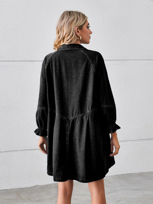 Black denim shirtdress with ruffled cuff sleeves and a gathered skirt.