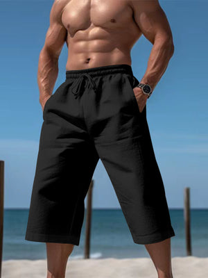 Black relaxed fit drawstring cropped sweatpants with pockets.