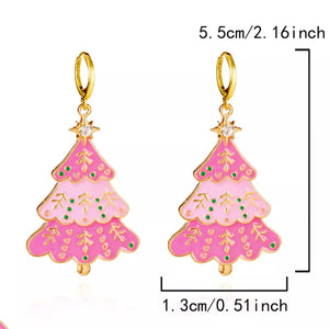 Christmas tree dangle earrings in blush pink with green polka dots and gold accents.