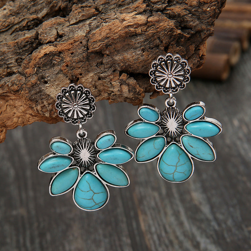 Teal floral petal drop earrings with silver alloy setting.