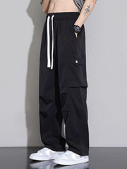 Men's black relaxed fit cargo sweatpants with white drawstring and side pockets.