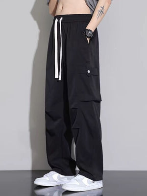 Men's black relaxed fit cargo sweatpants with white drawstring and side pockets.