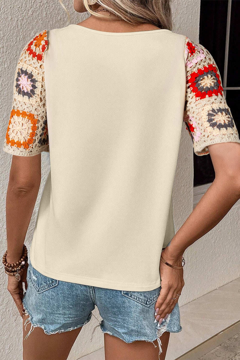 Ivory tee with colorful crochet granny square short sleeves