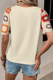 Ivory tee with colorful crochet granny square short sleeves