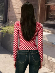 Red gingham tie-front long sleeve maternity shirt with a cropped fit.