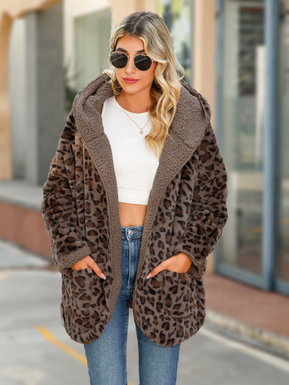 Leopard print sherpa hooded duster coat in chestnut with open front and pockets.