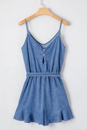 Medium denim romper with spaghetti straps, tie waist, and ruffled hem