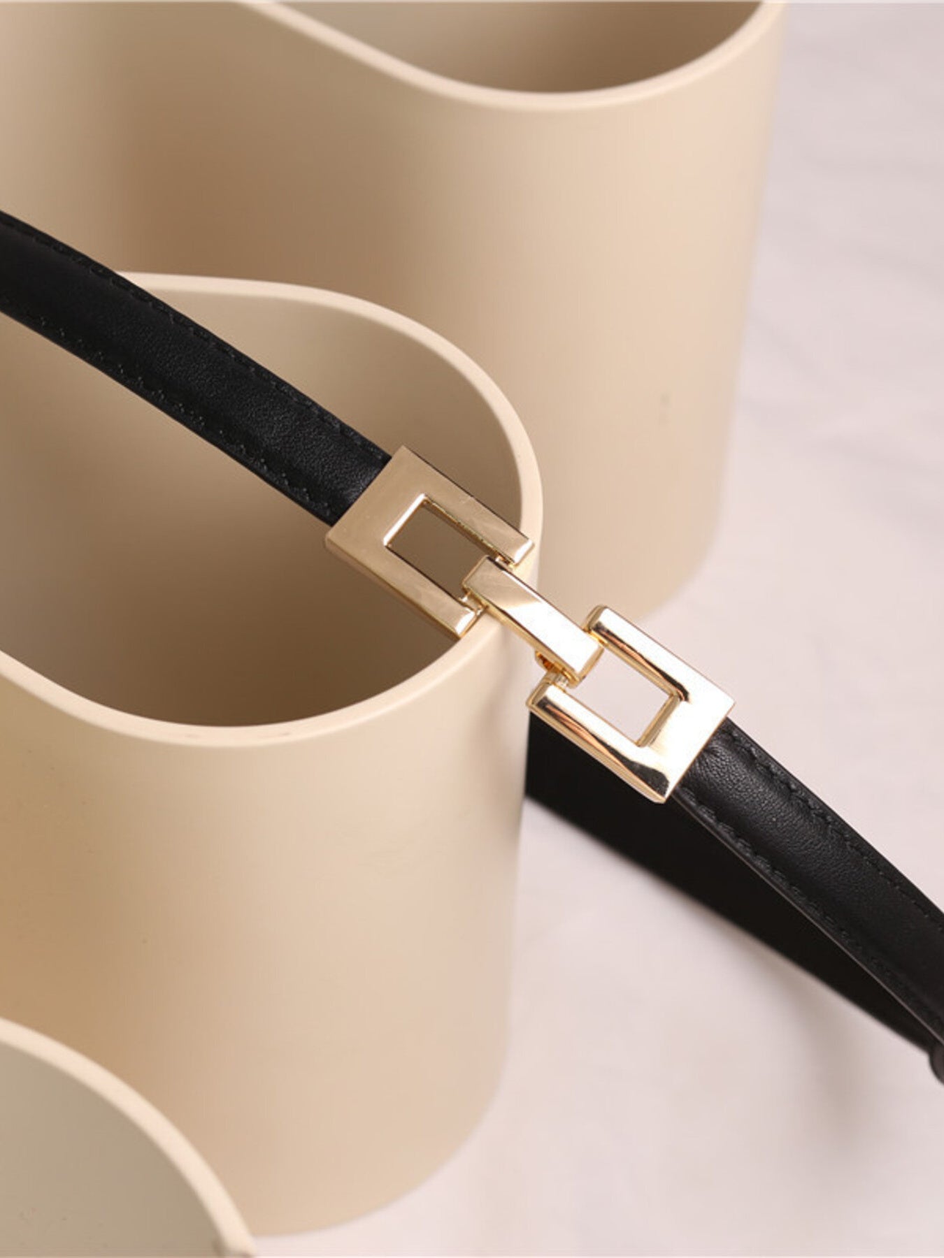 Black cowhide leather belt with a gold square buckle detail