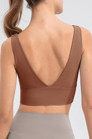 Sculpted backless crop top in caramel with a deep V-neckline and wide band.