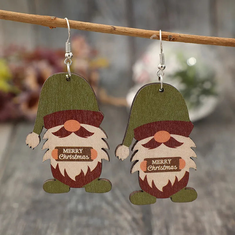 Merry Christmas gnome wood dangle earrings in matcha green with festive details.