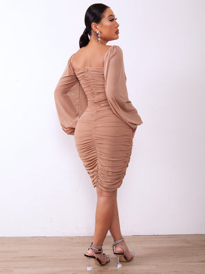 Brown ruched bodycon dress with sheer sleeves and a sweetheart neckline.
