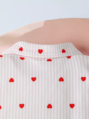 White cotton blend bodysuit with pink stripes and red hearts.