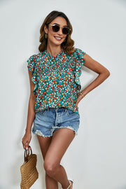 Teal floral ruffle sleeve blouse with smocked yoke and mock neck.