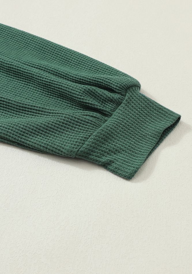 Waffle knit raglan top in Black Forest green with cuffed sleeves.