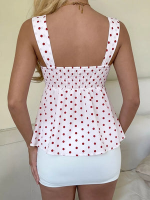 White polka dot camisole with smocked bodice and tie detail, polyester.