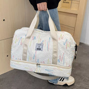 Textured off-white duffel bag with colorful wave pattern and dual handles.